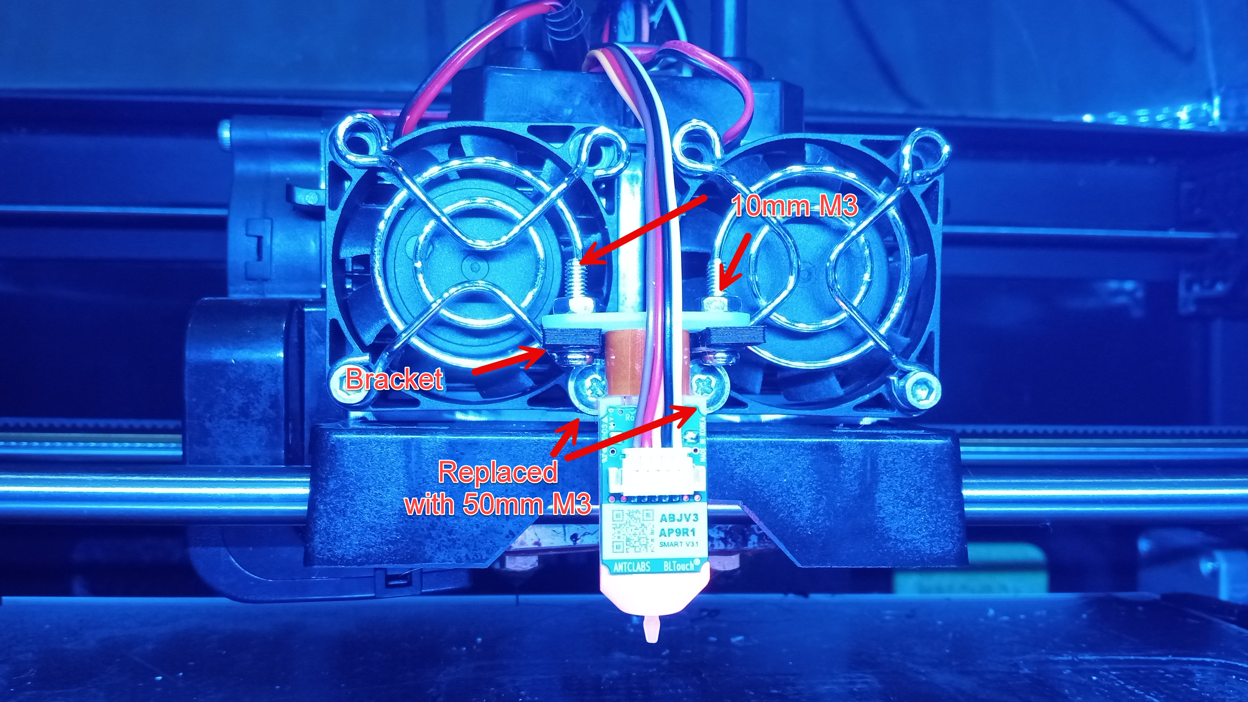 Photo showing how the BL Touch is mounted onto the extruder carriage on the BL Touch, with the bolts and bracket labelled.