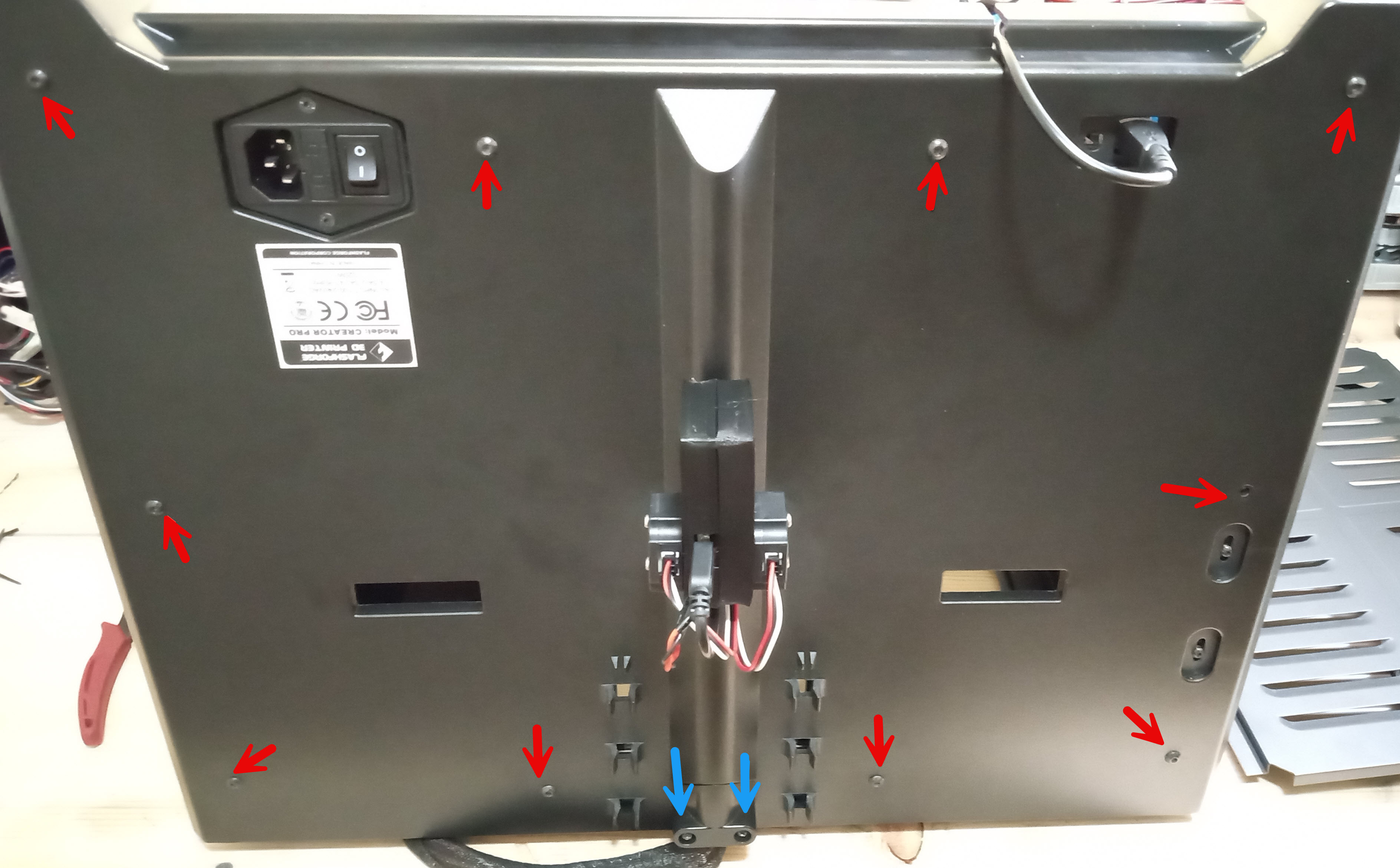 Photo showing the locatino of the 10 bolts on the back panel, as well as the two screws for the cable harness of the Creator Pro.